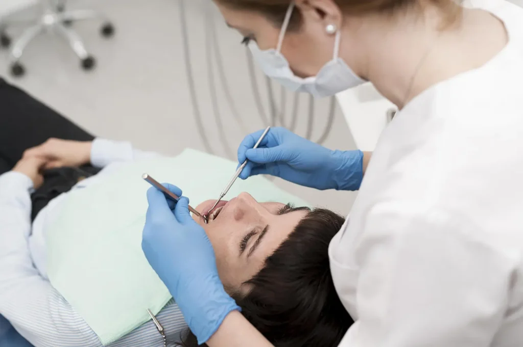 A female patient undergoing scaling and root planing at Parkway Family Dental