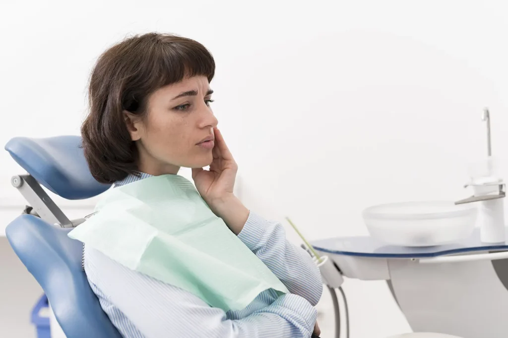 A woman holding her jaw ready for TMJ treatment from Parkway Family Dental in Kalispell, MT